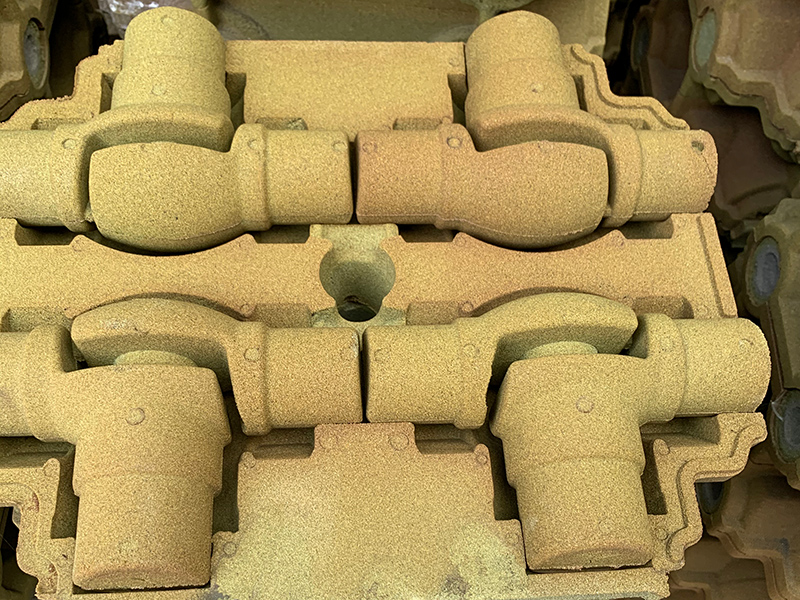 Làm thế nào để giải quyết khiếm khuyết dính cát trong việc sản xuất các bộ phận gang xám bằng công nghệ cát phủ màng?